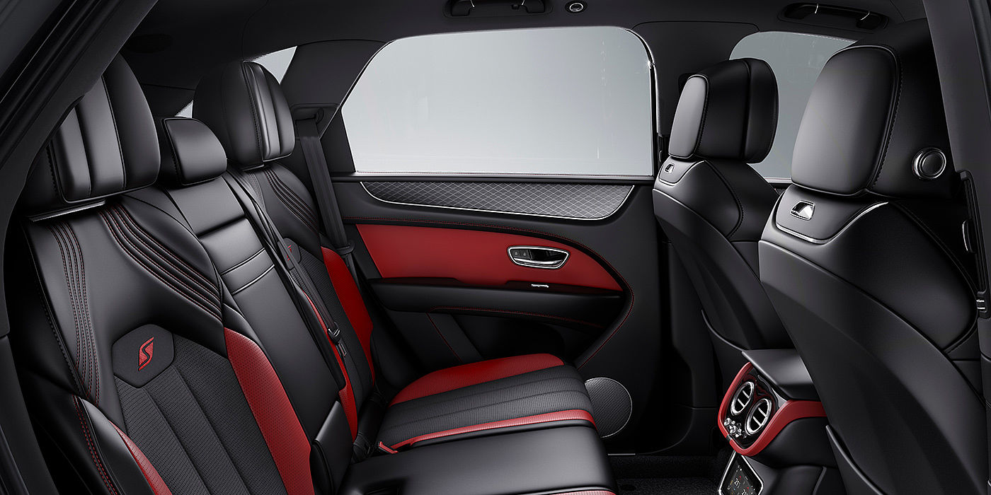Bentley Chengdu - Jinniu Bentey Bentayga S interior view for rear passengers with Beluga black and Hotspur red coloured hide.